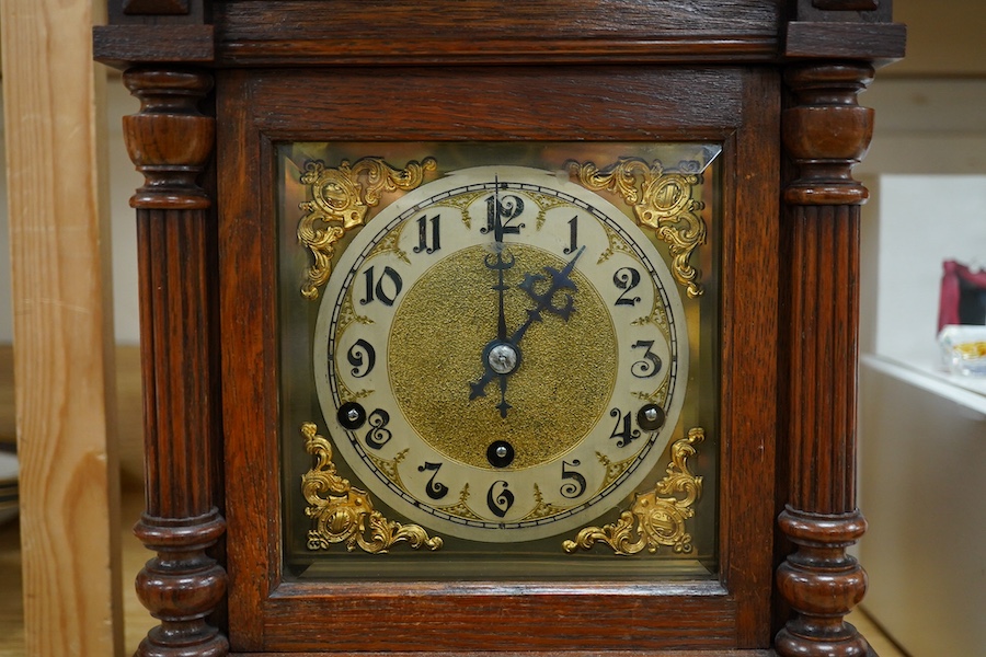 A late 19th century German oak three train mantel clock, 38.5cm high. Condition - fair, untested